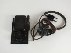 German T.1 morse key and a set of headphones