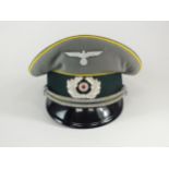 A German Second World War Heer (Army) Signal Officer's visor cap