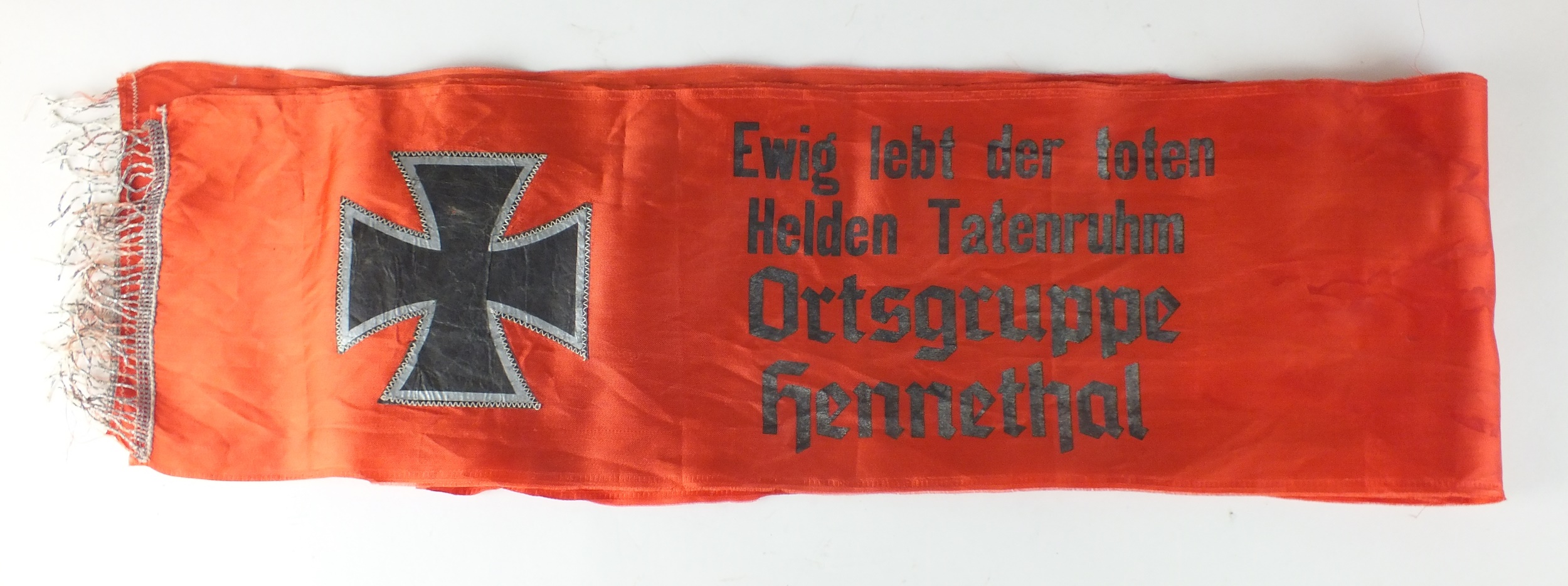 A German Third Reich silk funeral sash of rectangular form with tasselled ends, with silver leaf