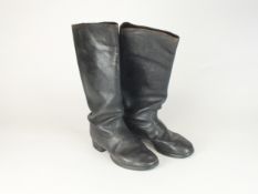 A pair of German WW2 black leather jack boots with interior pulls (one heel slightly loose)