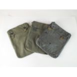 Three German Third Reich Second World War gas cape pouches, comprising two rubberised and one cloth,