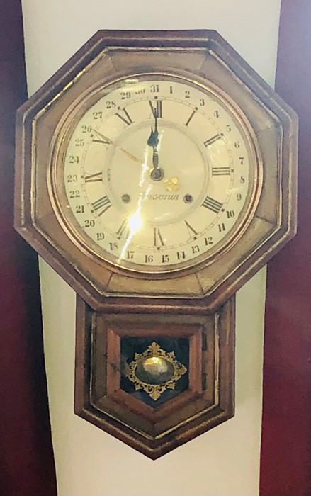 A late 19th century American Ansonia wall clock, octagonal form, brass circular glazed front dial,