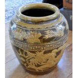 A brown glazed jardiniere decorated with a Chinese dragon, 2 Chinese teapots with metal mounts and a