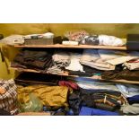 The contents of a storeroom to include fabric, 3 large rolls of brown paper as used in pattern