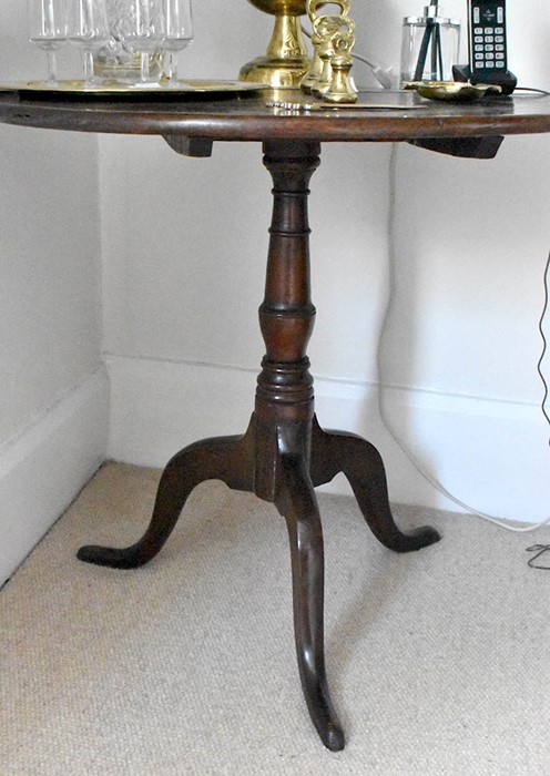 A George III oak tilt top table, circa 1780, circular top on a turned column raised on acanthus trio - Image 2 of 2