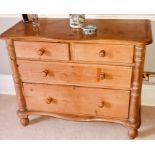 A 20th century pine chest of drawers, serpentine slight oversailing top, above two short and two