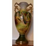 A pair of vases depicting birds in a landscape.. One vase broken and repaired.