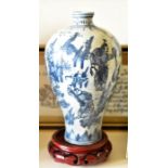 A group of Oriental ceramics to include 2 blue & white baluster vases on wooden stands, a blue &