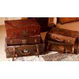 An early 20th Century Dutch leather suitcase; others similar. (5)