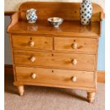 A Victorian style pine washstand chest, three quarter scrolling gallery, moulded front top, above