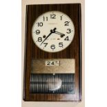 A 20th Century 31 day chiming President wood cased wall clock with day and date display 42cm H