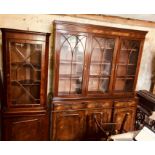 A 20th century mahogany bookcase, dental cornice above three glazed doors with Gothic style