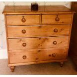 A Victorian style pine chest of drawers, rectangular moulded edge top, above two short and three