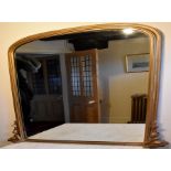 A large gilt framed mirror.