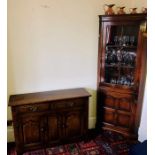 A 20th century oak sideboard; a similar corner cupboard. (2)