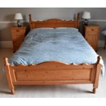A 20th Century pine bedroom suite, double bed, pair of bedside cabinet, bedroom chair and