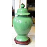 A green glazed ginger jar and cover converted to a table lamp and a Chinese terracotta teapot and