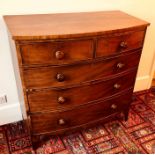 A Victorian mahogany bow front chest of drawer, circa 1860, slight oversailing top above two short