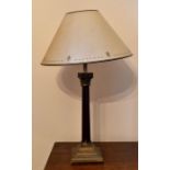 A modern Laura Ashley table lamp, corinthian column design with metal mounts top and bottom.