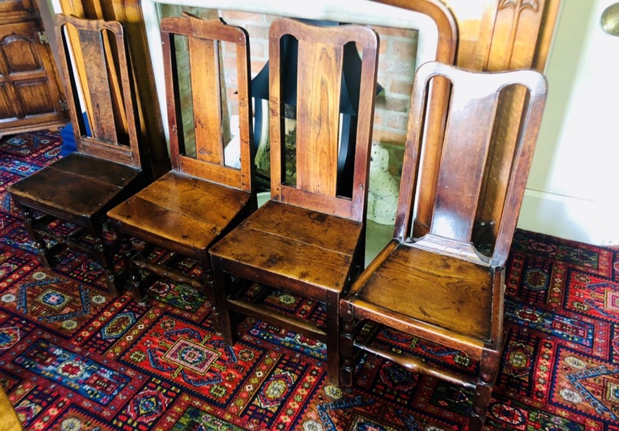 A set of seven similar 18th century and later oak chairs. (7)