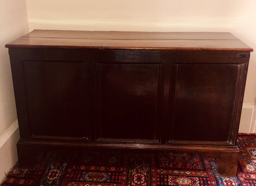 A late 17th Century oak blanket chest, later lid hinged fitted enclosing compartment three moulded