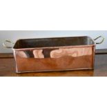 A copper and brass rectangular planter.