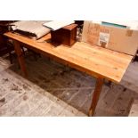A 20th Century pine grained kitchen table 76cm H x 152cm W x 77cm D
