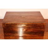 An early Victorian rosewood writing slope, circa 1860, hinged lid enclosing fitted interior. 13cm