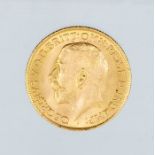 A 1911 George V gold sovereign, London mint.