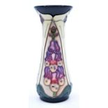 Moorcroft Pottery: A Moorcroft 'Foxgloves and Arum Lily' pattern vase designed by Rachel Bishop.