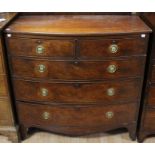 A George III mahogany bow fronted chest of drawers, circa 1810, comprising two short drawers over
