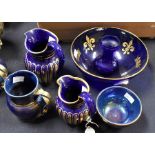 Blue lustre 19th Century water jugs along with other blue and gold graduated water jugs, glass