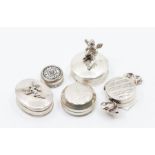 A collection of 925 stamped silver pill boxes to include: sweet shaped; oval with fairy applied to