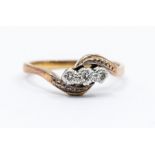 A diamond and 9ct gold cross over ring, diamond weight approx 0.10ct,  size N1/2, total gross weight