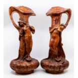 A pair of Austrian composite single handled figural vases, in the form of a man and a woman, in