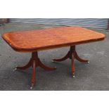 A modern yew veneered cross-banded dining table, of twin-pedestal form, 240cm long, 107cm wide, 74cm