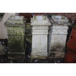 Three composite chimney pots, of square sectioned form, each measuring 82cm high approx. (3)