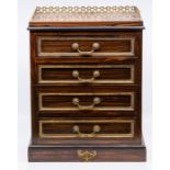 A Victorian ormolu mounted coromandel table top cabinet, having three-quarter pierced ormolu gallery