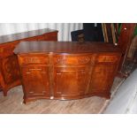 A Georgian style mahogany sideboard, of serpentine form, measuring 93cm high, 153cm wide, 54cm deep,