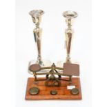 A pair of George V silver candlesticks, Chester 1911, filled bases, approx 22cm high (one