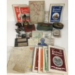 A collection of train ephemera including postcards, maps, travel guilds, tins etc