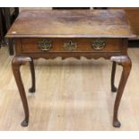 A mid 18th Century oak side table, fitted with a single drawer fitted with brass handles and an