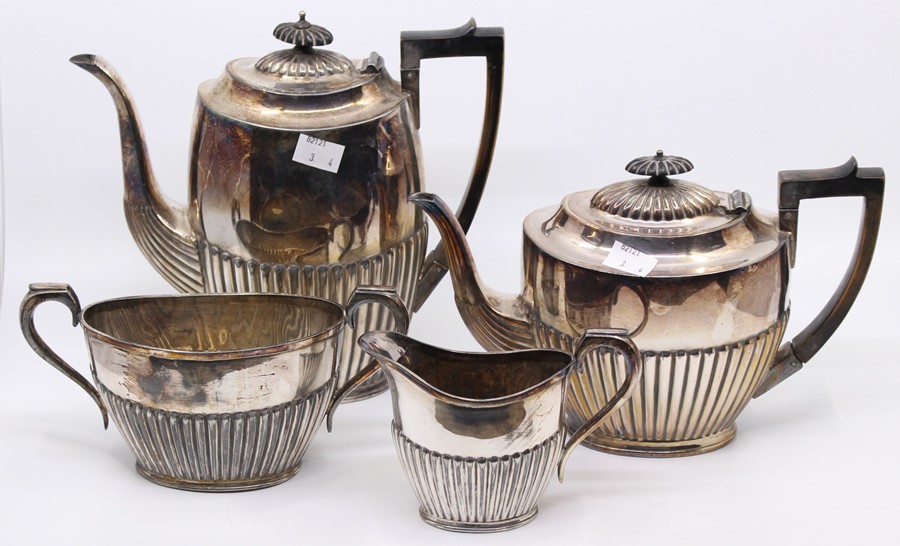 An early 20th Century Georgian style plated four piece tea and coffee set, gadroon lower sections (