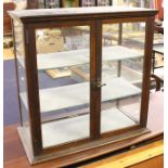 An early 20th Century mahogany shop glazed display cabinet, circa 1920, 69cm high, 69cm wide, 35cm