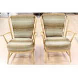 A pair of Ercol beech armchairs, rodded backs, removable cushions