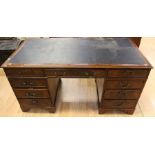 An Georgian style mahogany twin pedestal desk, early 20th Century, comprising long central drawer