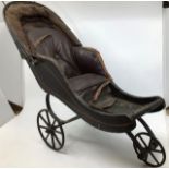 Dolls Prams, two wicker style and a larger pushchair with metal frame and faux leather/rexine seat