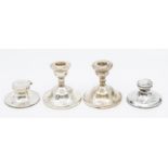 A pair of Elizabeth II silver dwarf candlesticks, by S&M, London,, 1970, filled and two plain