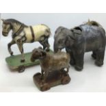Vintage wooden and ceramic toys: outstanding collection of toys to include a wheeled elephant with