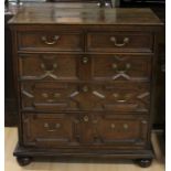 An early 18th Century joined oak chest of drawers, probably made during the reign of Queen Anne,